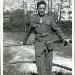 Clarence Matsumura standing near a river