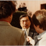 Gordon Hirabayashi being interviewed outside the courthouse