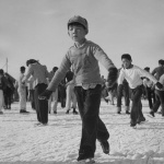 Young former California boy learning to ice skate at Heart Mountain incarceration camp