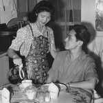 Mr. and Mrs. George Amano having breakfast in their apartment in Detroit, Michigan