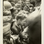 Soldiers getting autographs from actress Marilyn Hare